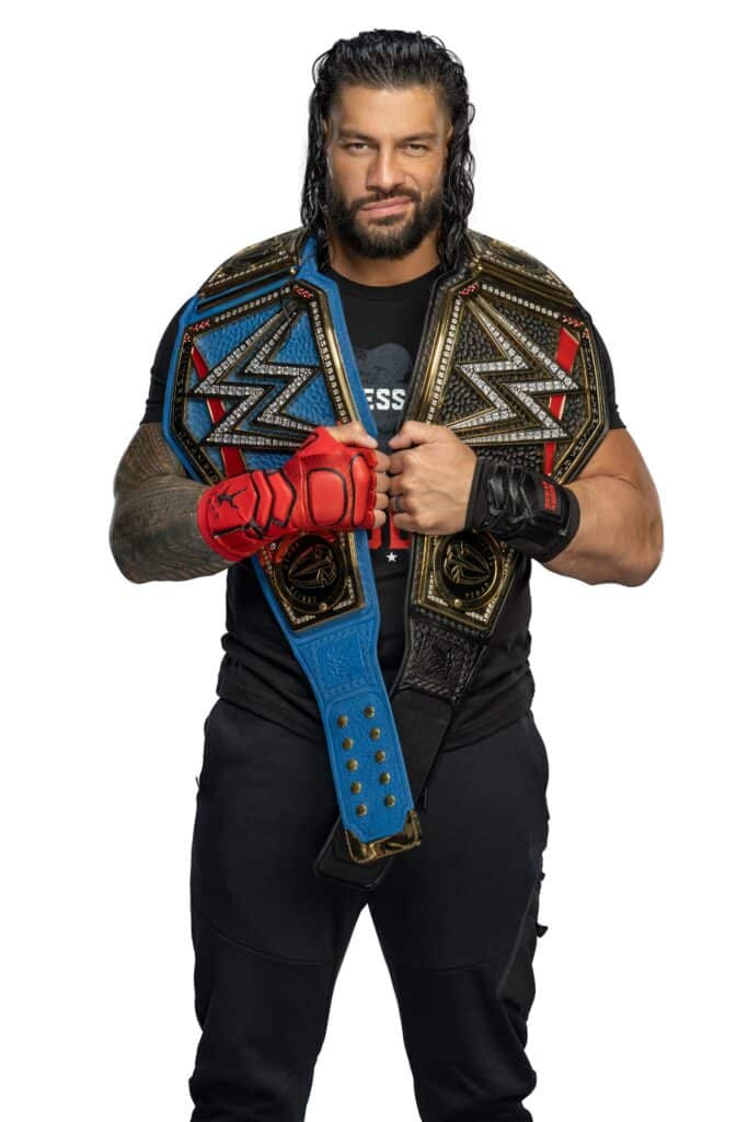 3. Roman Reigns with Championship Title Belts